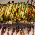 A delicious mixture of shrimp, scallops, mushrooms, rice and sweet onion, baked in our secret mayo sauce, then topped with avocado and sweet sauce