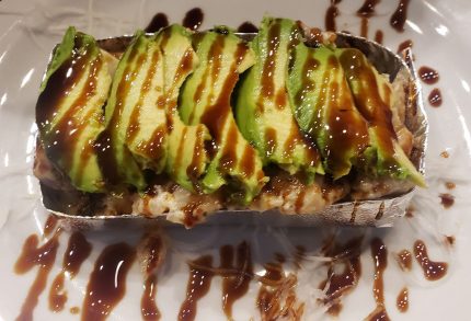A delicious mixture of shrimp, scallops, mushrooms, rice and sweet onion, baked in our secret mayo sauce, then topped with avocado and sweet sauce
