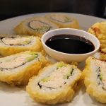 Inside: crab, avocado, cucumber
Outside: deep-fried in a tempura batter, drizzled with sweet sauce