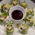 Inside: cucumber, deep fried asparagus, tofu
Outside: avocado, sprouts, drizzled with ponzu sauce