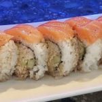 Inside: crab, cucumber and avocado
Outside: fresh salmon drizzled with ponzu sauce