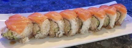 Inside: crab, cucumber and avocado
Outside: fresh salmon drizzled with ponzu sauce