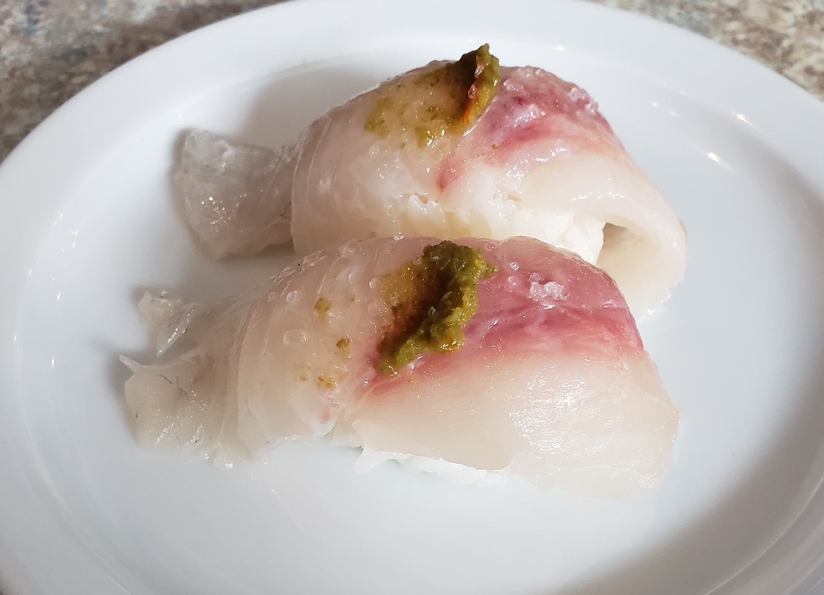 Black Snapper Sushi Go Fish Sushi Bar - Simi Valley, CA Traditional style - 2 pieces served over rice.