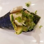 Cooked Chilean Sea Bass, avocado, crab meat, green onions, topped with ponzu sauce, wrapped in seaweed.