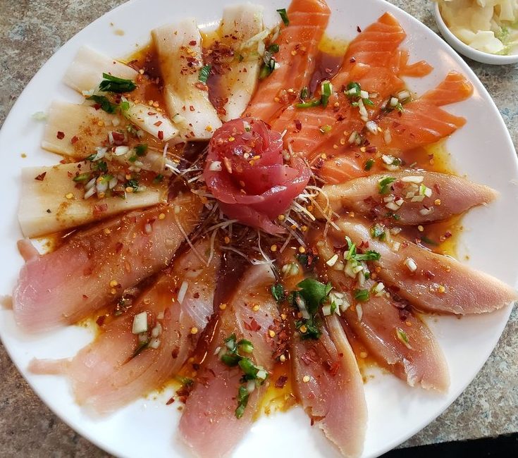 Chef's Favorite Carpaccio Platter Go Fish Sushi Bar - Simi Valley, CA Thinly sliced fish drenched in finely chopped jalapeño and onions then based in chili oil sauce. AMAZING!!