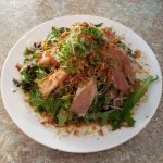 Mixed greens, cucumber, avocado, seared albacore, drizzled with garlic sauce dressing and crispy onions!

Each of our salads are served with their very own unique dressings!