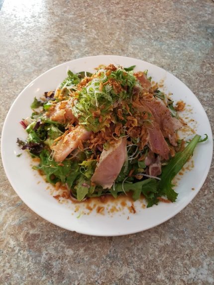 Mixed greens, cucumber, avocado, seared albacore, drizzled with garlic sauce dressing and crispy onions!

Each of our salads are served with their very own unique dressings!