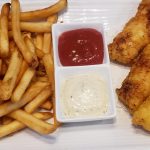 Beer battered North Atlantic Cod with french fries and tarter sauce.