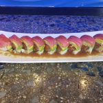 Inside: salmon, spicy tuna, avocado
Outside: white fish, thinly sliced lemon, drizzled with ponzu, yuzu, and siracha, then sprinkled with chili powder & green onion