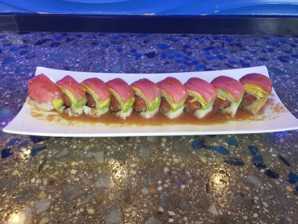 Inside: salmon, spicy tuna, avocado
Outside: white fish, thinly sliced lemon, drizzled with ponzu, yuzu, and siracha, then sprinkled with chili powder & green onion