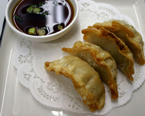 Gyoza Go Fish Sushi Bar - Simi Valley, CA 4 pieces of a traditional dumpling, stuffed with a pork and vegetable mixture, steamed or fried to perfection and served with a tempura sauce