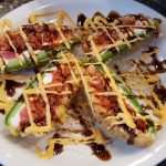 Spicy tuna and cream cheese stuffed in a fresh jalapeno shell; fried in a tempura batter, then cut in half and drizzled with a sweet and spicy sauce.