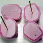 Small round dessert ball of ice cream wrapped in a rice cake covering strawberry, vanilla, kona coffee, green tea, mango
