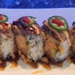 Inside: shrimp tempura, spicy crab and avocado
Outside: seared tender fillet mignon and sliced jalapeno drizzled with sweet and spicy sauce - our most unique and delicious roll