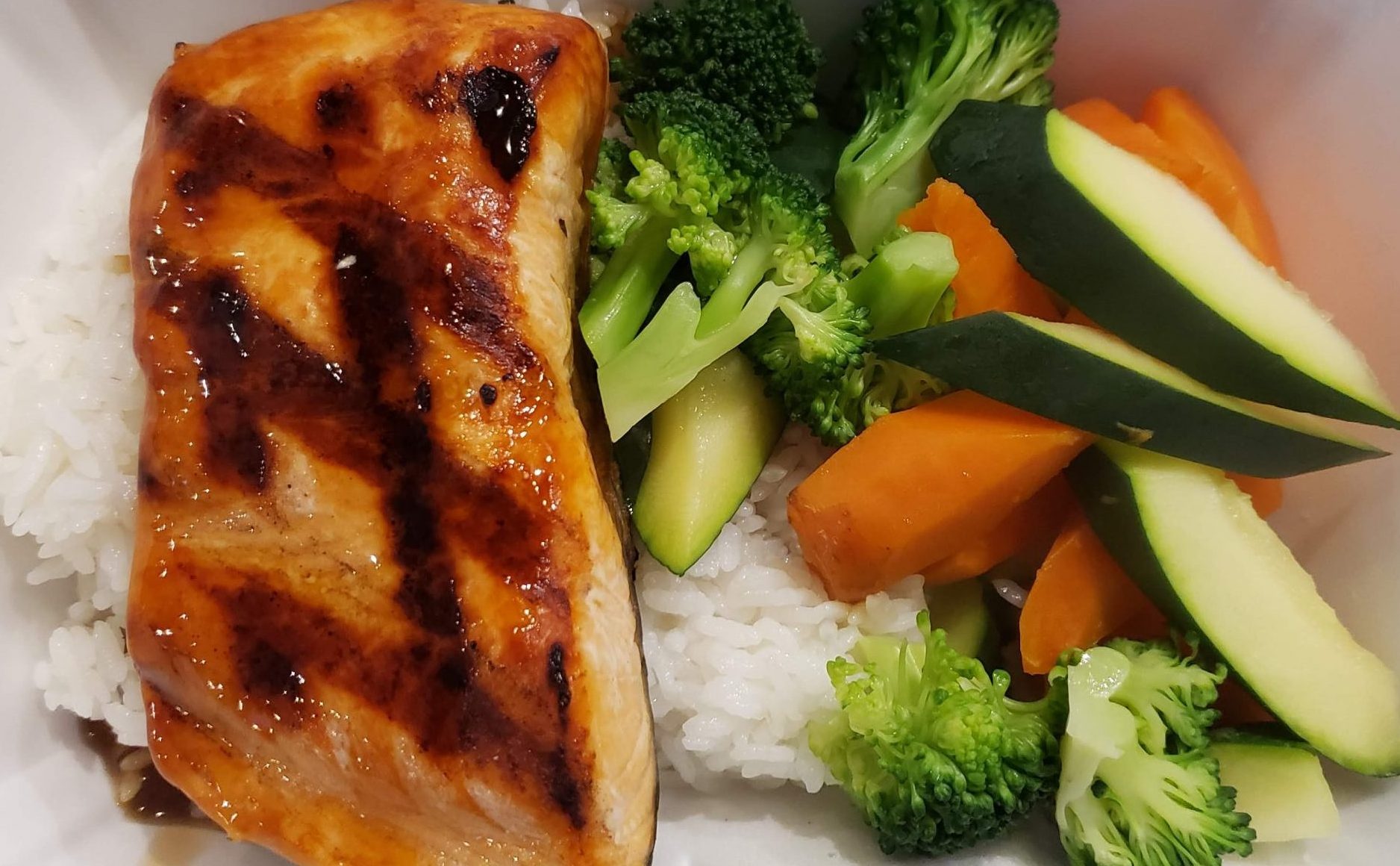 Salmon Teriyaki Bowl Go Fish Sushi Bar - Simi Valley, CA Sliced salmon and assorted vegetables drizzled with our very own teriyaki sauce.
All bowls served over a bed of steamed white rice, fried rice can be substituted for an additional $2.00