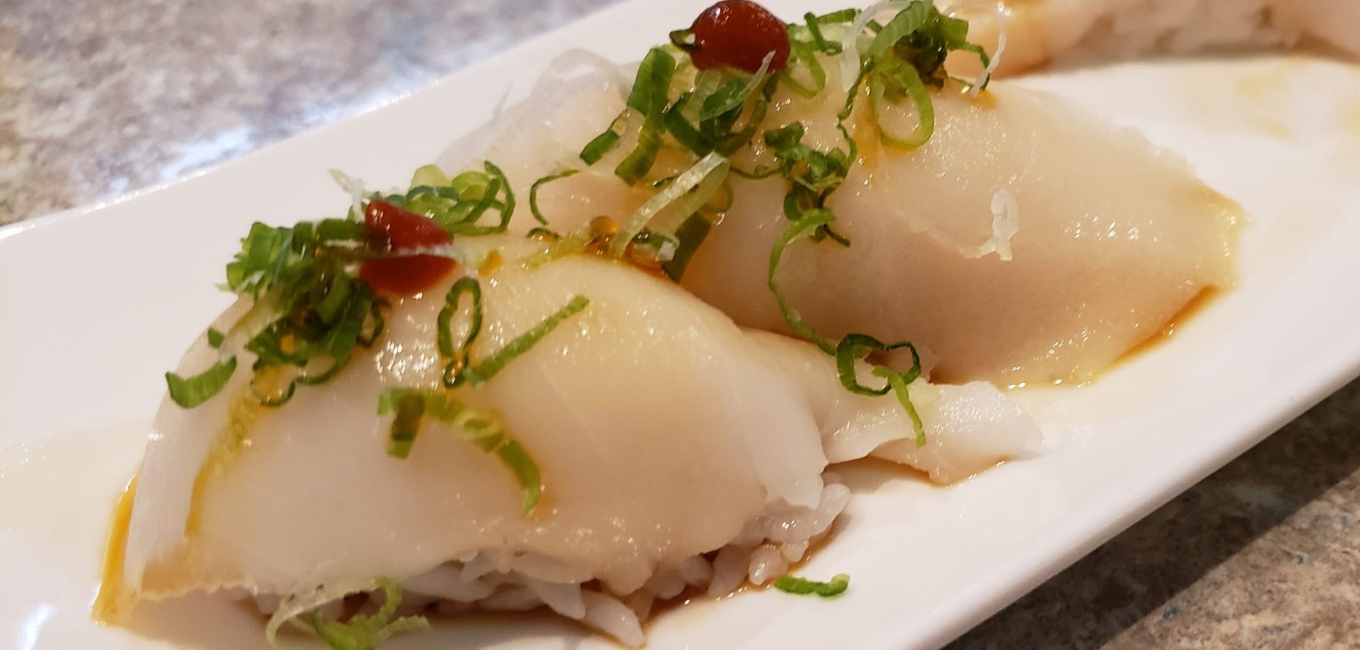 White Tuna Sushi Go Fish Sushi Bar - Simi Valley, CA Traditional style - 2 pieces served over rice
(Pictured with a siracha topping, available on request)