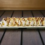 Inside: shrimp tempura, crab meat, avocado and cucumber
Outside: crunch flakes drizzled with sweet sauce
