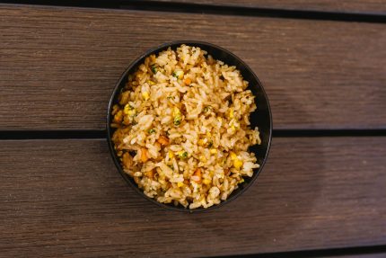 A delicious bowl of fried rice mixed with egg and vegetables