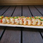 Inside: spicy tuna, shrimp tempura, and cucumber Outside: fresh yellow tail, jalapenos, drizzled with ponzu sauce and a dab of sriracha &nbsp;