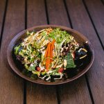 Mixed greens, gobo root and avocado on top of a tuna and crab roll, drenched in our secret sweet and sour dressing - delicious!
