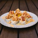 Inside: shrimp tempura, spicy crab meat and avocado
Outside: six different types of fish, mixed in a spicy sauce with crunch flakes