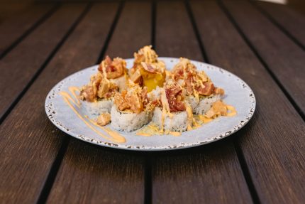 Inside: shrimp tempura, spicy crab meat and avocado
Outside: six different types of fish, mixed in a spicy sauce with crunch flakes