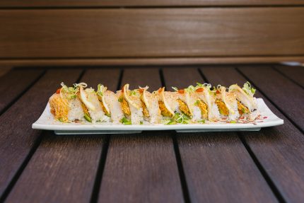 Inside: salmon, spicy crab, avocado
Outside: white fish, thinly sliced lemon, drizzled with ponzu, yuzu, and siracha, then sprinkled with chili powder & green onion