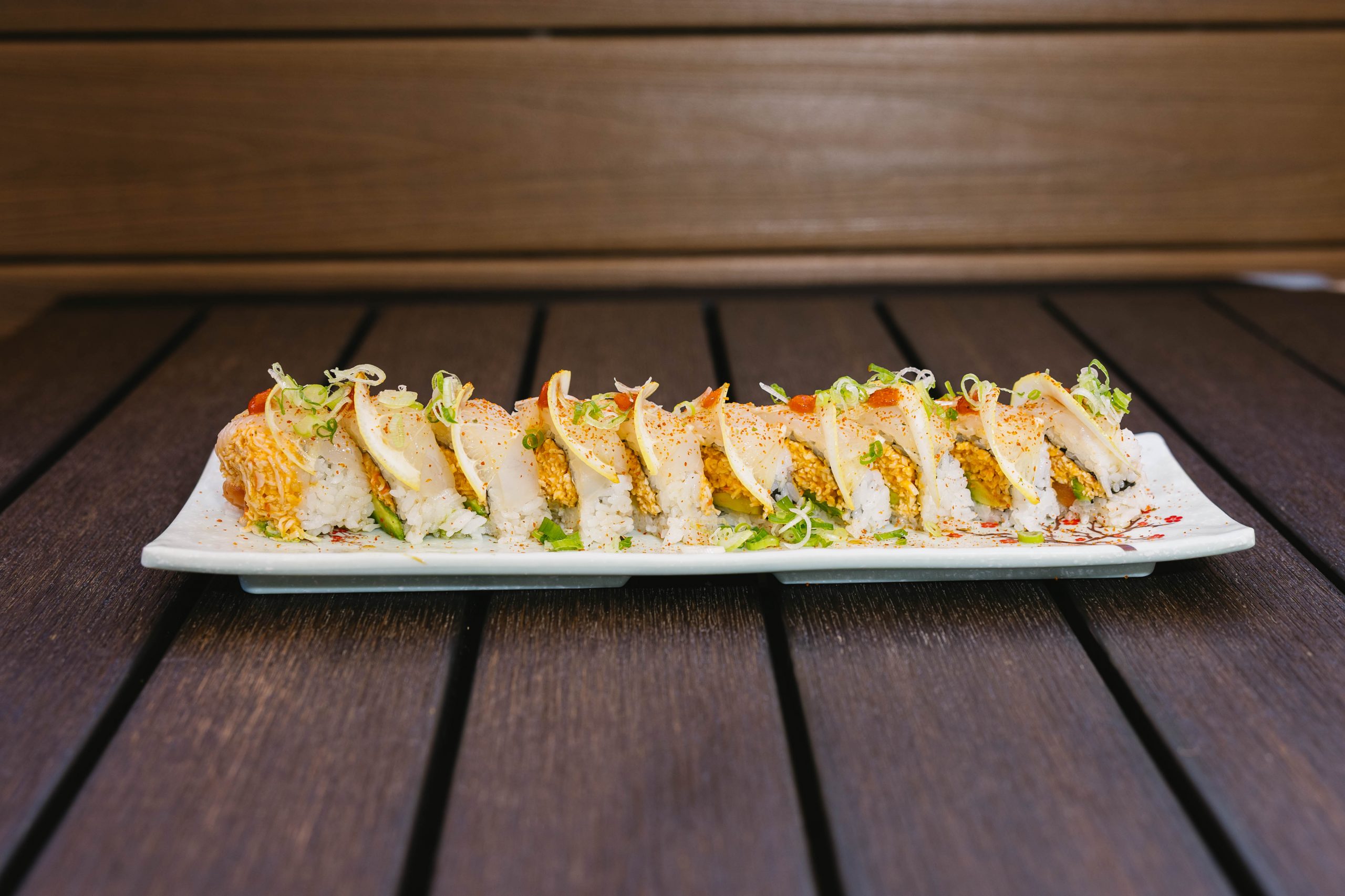 Scooby Doo Roll Chef's Favorite Go Fish Sushi Bar - Simi Valley, CA Inside: salmon, spicy crab, avocado
Outside: white fish, thinly sliced lemon, drizzled with ponzu, yuzu, and siracha, then sprinkled with chili powder & green onion