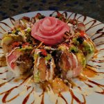 Inside: spicy tuna, spicy crab, shrimp tempura
Outside: tuna, albacore, avocado with assorted sauces and tobico, featuring a delicious tuna rose