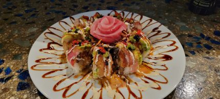 Inside: spicy tuna, spicy crab, shrimp tempura
Outside: tuna, albacore, avocado with assorted sauces and tobico, featuring a delicious tuna rose