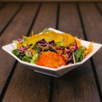 Mixed greens, tomatoes, carrots, cucumbers and sliced avocado.
Each of our salads are served with their very own unique dressings!