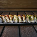 Inside: shrimp tempura, crab meat, avocado and cucumber Outside: freshwater eel and avocado drizzled with sweet sauce