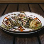 Inside: freshwater eel, spicy tuna, avocado
Outside: deep-fried tempura batter, drizzled sweet sauce and green onion