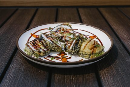 Inside: freshwater eel, spicy tuna, avocado
Outside: deep-fried tempura batter, drizzled sweet sauce and green onion