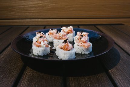 Inside: salmon, crab and avocado
Outside: minced salmon and white onion topped with black tobico