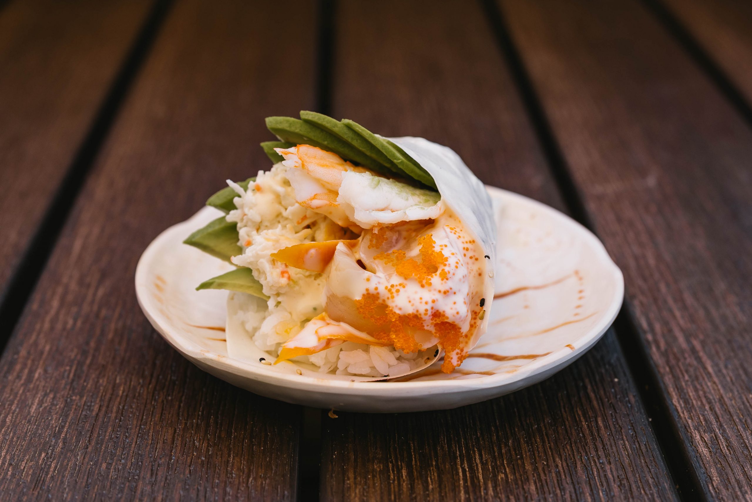 Wow! Hand Roll Chef’s Favorites Go Fish Sushi Bar - Simi Valley, CA A delicious blend of scallops, shrimp, crab meat, avocado, gobo root and tobico, mixed in a spicy cream sauce, wrapped in soy paper.